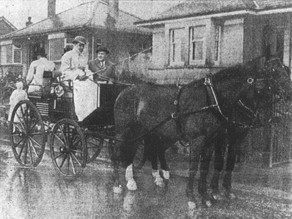 Harry Hawkins drives Provost W Macfarlane Gray in heavy rain.